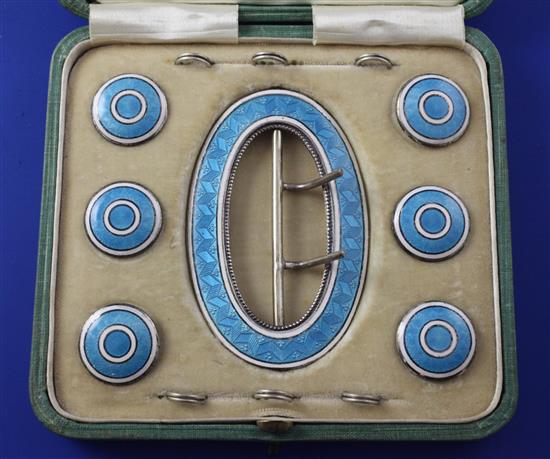 A cased Edwardian seven piece silver and guilloche enamel buckle and button set, buckle 3in.